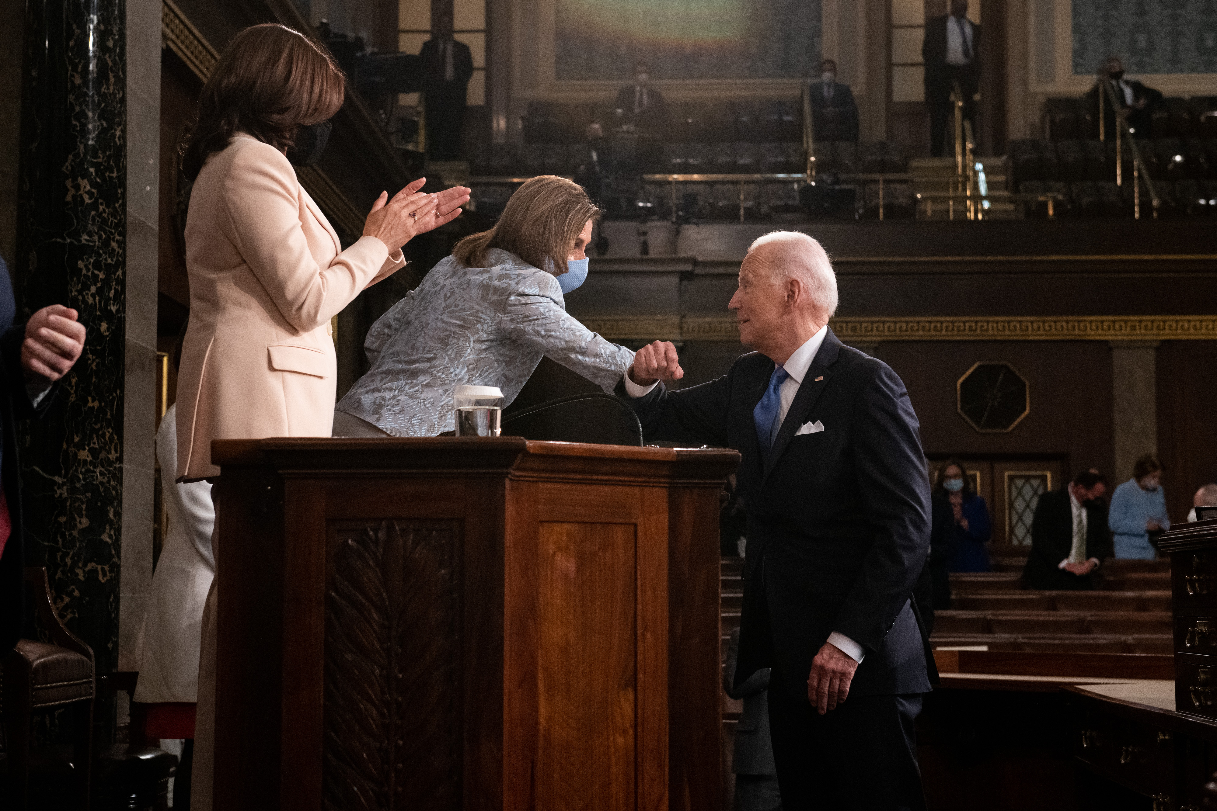 President Joe Biden bumps elbows with U.S. House of Representatives Speaker Nancy Pelosi