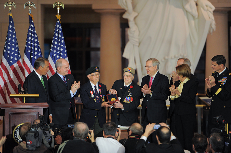 Congressional leaders present a medal to 1st Special Service Force veterans