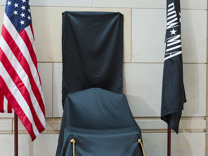 Members of Congress unveiled the commemorative chair honoring American prisoners of war