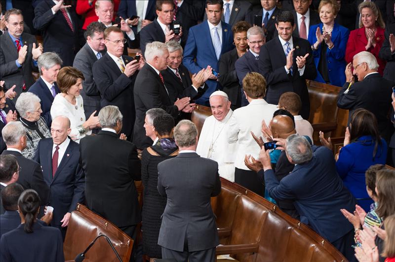 Pope Francis enters the House chamber